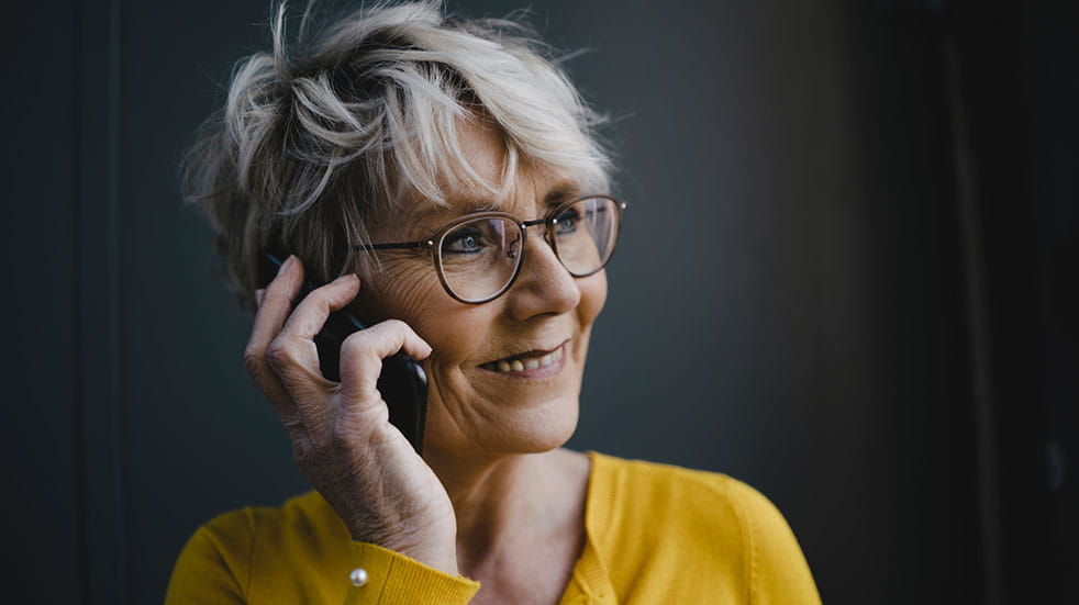 How to volunteer this Christmas smiling woman on phone